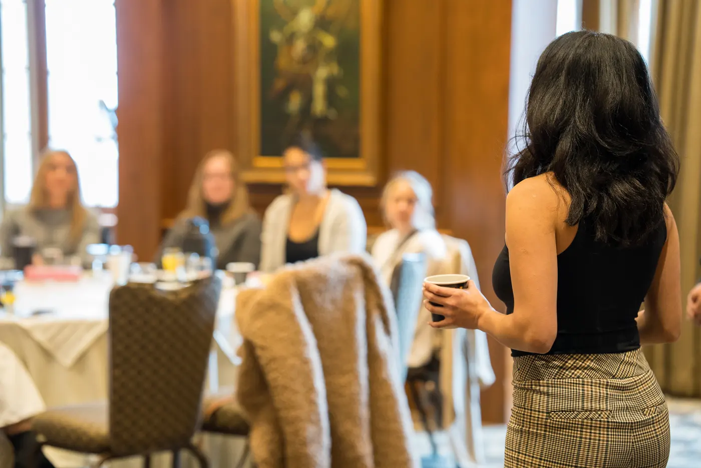 Eve holding a room of women at a workshop gathering